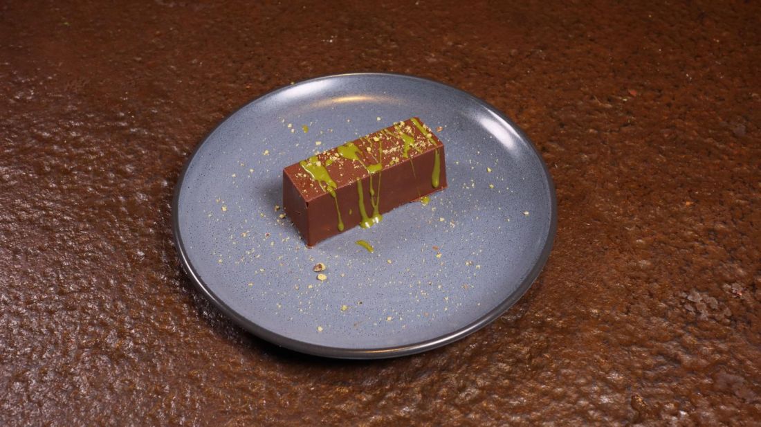 Chocolate dessert bar with a pistachio drizzle